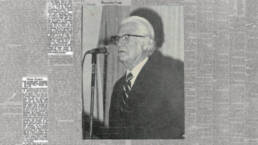 maxwell maltz standing at microphone